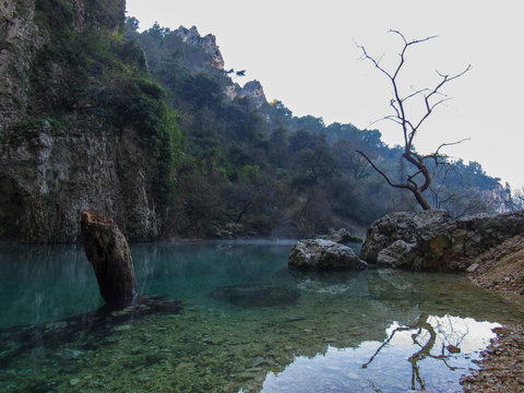 Provence France, Fontaine de Vaucluse: Mysterious landscape with a spring in a valley at the foot of the Vaucluse Mountains
