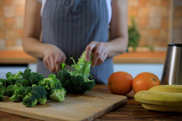 The chef prepares broccoli for fresh green detox food
