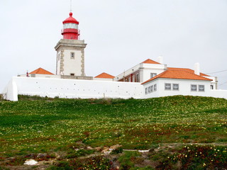Fototapeta na wymiar Lighthouse of Cabo da Roca (Cape Roca) in Sintra. The most western point of Europe.