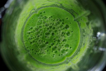 Blended green smoothie with broccoli and banana