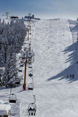 Winter ski resort,ski lift,people skiing. Uludag Mountain, Bursa, Turkey