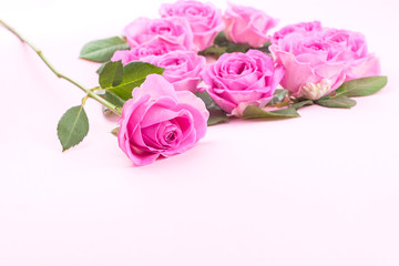 roses and envelope on a light background. Bouquet and letter as a gift in the concept of Valentine's Day and Women's Day. Free space for text.