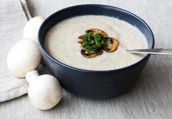 Bowl of vegetable cream soup with mushrooms.