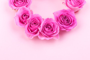 Pink roses on a gentle background. Bouquet as a gift. Card with flowers for the holiday. Free space for text.