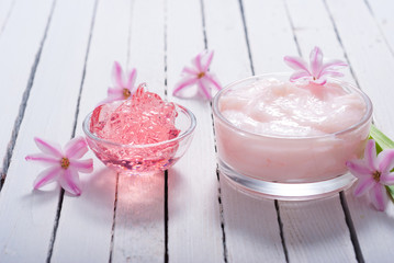 beauty products with hyacinth flowers on white wood