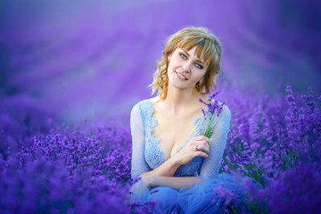 Beautiful Bride in wedding day in lavender field. Newlywed woman in lavender flowers.