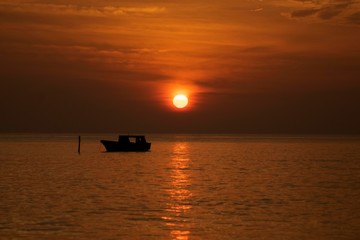 fishing boat at sunrise