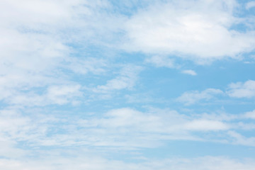 Fluffy blue sky background and white clouds soft focus, and copy space