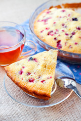 Piece of homemade cowberry pie on a pate