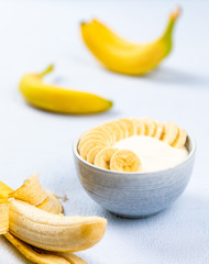 Fototapeta na wymiar cream dessert with fruit in a bowl on blue background