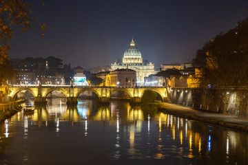 Fototapeta premium Rome night skyline with Vatican St Peter Basilica and St Angelo Bridge crossing Tiber River in the city center of Rome, Italy. It is historic landmark of the Ancient Rome and travel destination.