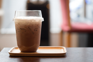 Iced coffee mocha with foam milk in takeaway cup