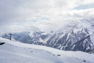 Fototapeta na wymiar ski slope in mountains in winter