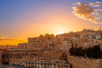 Fototapeta premium Sunset view of beautiful city of Valletta, capital city of Malta, known in Maltese as Il-Belt, scenic and colourful cityscape.