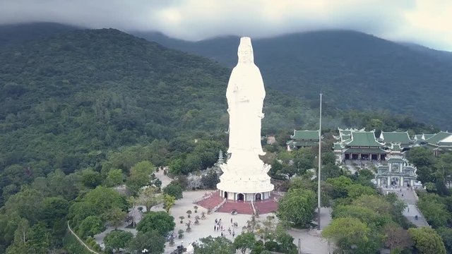 bird eye view great religious complex with large buddha statue triangular roof temple buildings and gate against hills