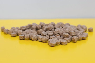 Product from bran on a yellow background. Healthy food