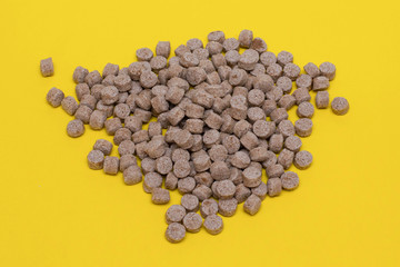 Product from bran on a yellow background. Healthy food