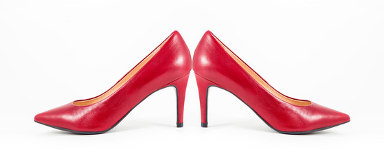 Elegant women's shoes made of red leather on a white background