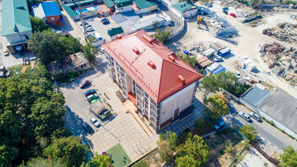 Fototapeta na wymiar New multi-storey residential building on the shore of the beautiful Gelendzhik Bay. Black sea coast of the Caucasus, resorts of Kuban. Another residential complex is being built nearby