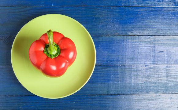 Sweet Red Bell Pepper On A Plate.