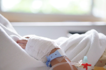 child or kid patients or sick in pediatric hospital with salt water or saline in blood vessels on...