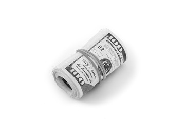 Hundred-dollar bills rolled into a roll isolated on white background