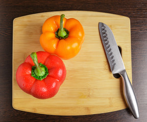 Bulgarian sweet pepper and a knife on the cutting Board.