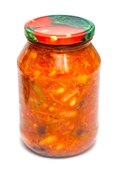 vegetable lecho in a glass jar on a white background