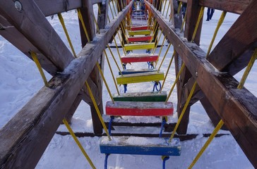 obstacle course of multicolored steps on the ropes.....