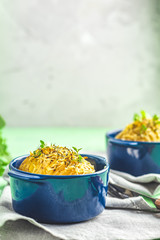 Delicious portion baked potatoes in cocotte blue ceramic baking molds