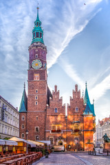 Fototapeta na wymiar Town Hall on the Market square in Wroclaw, Poland early in the morning. Vertical cityscape. Colorful cities concept.