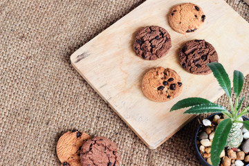 Obraz na płótnie Canvas Chocolate chip cookies bakery on Butcher Wood and Sack