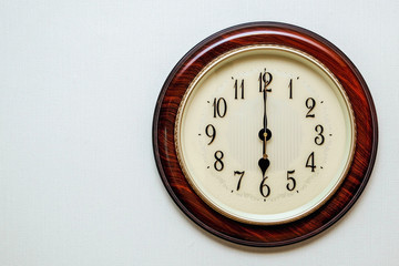 clock showing the time 18:00, 06:00