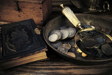 Old moneys and coins through a magnifying glass. Numismatics and collecting money.Russian Empire...