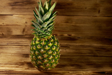 Whole pineapple on wooden table