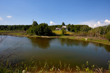 Fototapeta premium Russia. View of the village. Summer rural landscape with houses