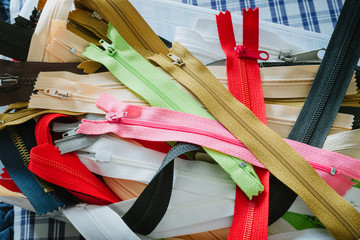 Zippers of various colors in the box