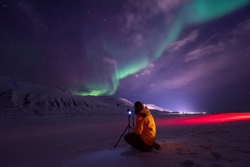 The polar arctic Northern lights aurora borealis sky star in Norway travel Svalbard in Longyearbyen...