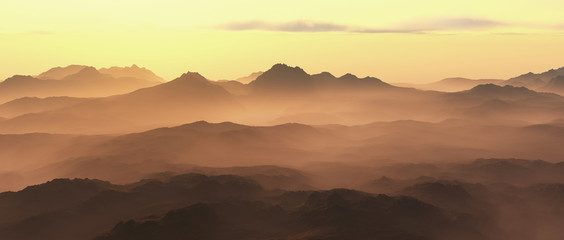 Mountains in mist at sunrise.