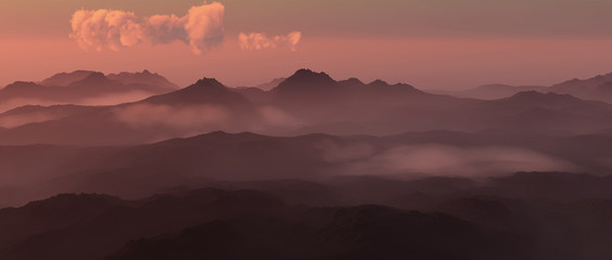 Mountain landscape in mist at sunset.