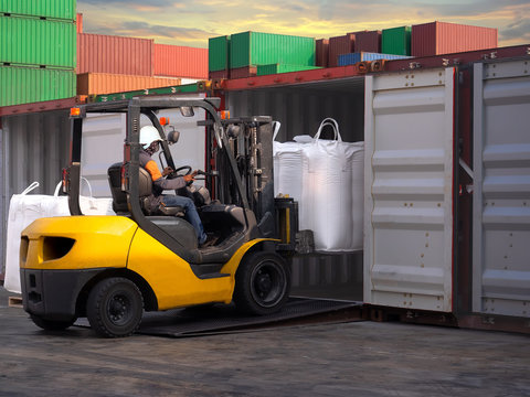 Tapioca in  jumbo bags are stuffing in container by forklift at stuffing yard.