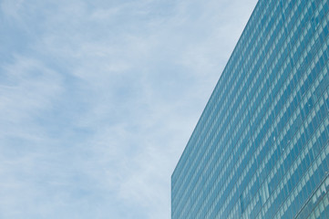 Fototapeta na wymiar Blue sky and futuristic modern corporate office building