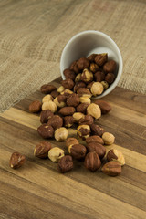 Hazelnuts spilled on wooden table