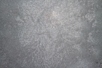 Frozen window photographed in the evening with a flicker of color