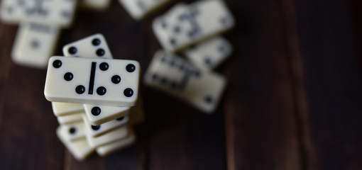 white dominoes on a wooden table