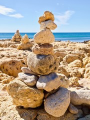 Pebbles pf stones at the beach, symbol for inner life balance in Zen meditation