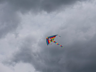Multicolored kite soaring in the sky