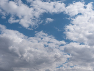 Naklejka na ściany i meble Beautiful white clouds in the blue sky