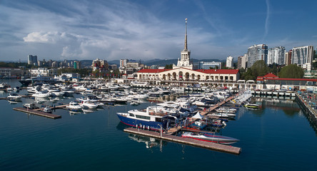 Yachts and boats anchored in the port of Sochi at sunset. Russia. Aerial view
