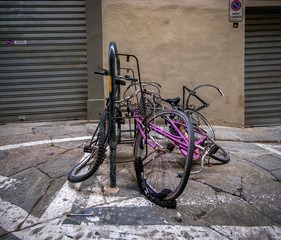 Naklejka na ściany i meble Abandoned bicycles. Streets of the old city of Florence. Italy.